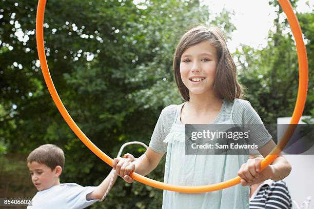 girl playing with hula hoop - ring toss bildbanksfoton och bilder