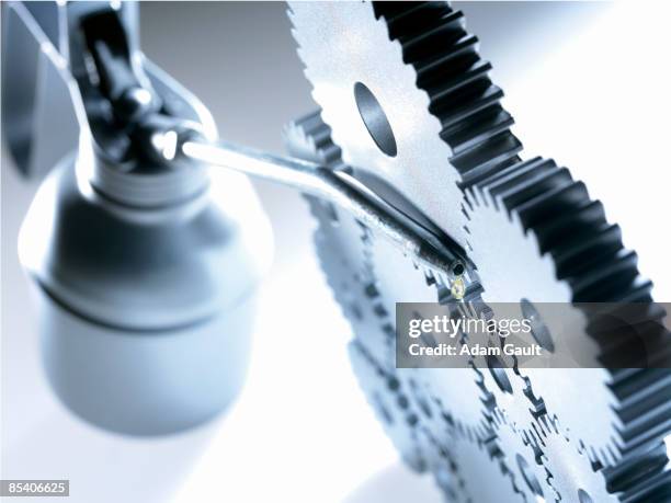 group of cogs with oil can - smörjning bildbanksfoton och bilder