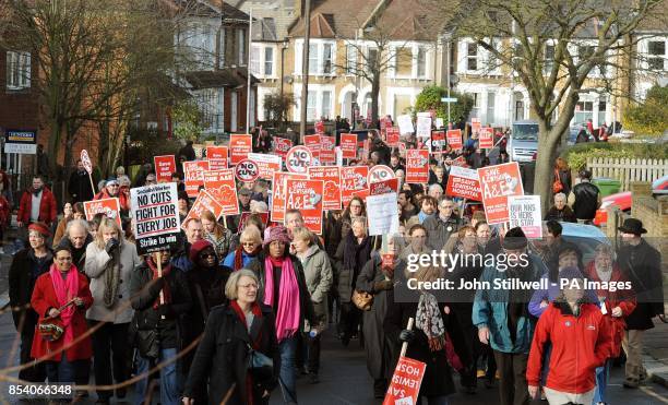 Protesters taking part in a demonstration against the possible closure of their local A&E and maternity services, at Lewisham Hospital in south-east...