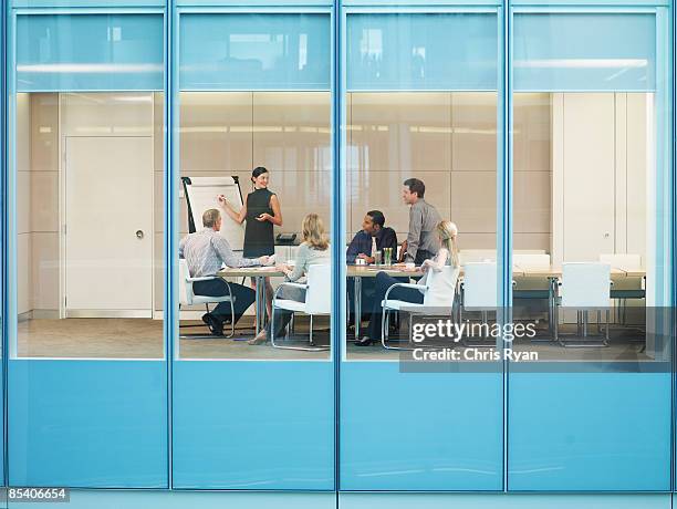 businesspeople having meeting in conference room - glass window stock pictures, royalty-free photos & images