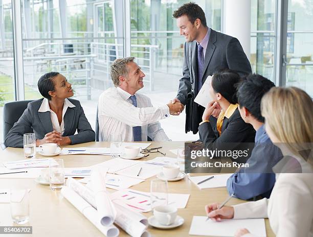 businesspeople having meeting in conference room - capital cities stock pictures, royalty-free photos & images
