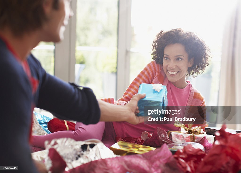 Man giving wife Christmas gift