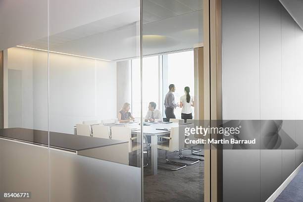 businesspeople having meeting in conference room - office window stock pictures, royalty-free photos & images