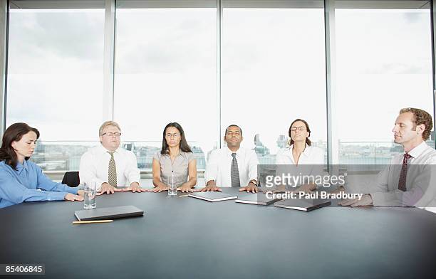 businesspeople having seance at conference table - séance photo stock pictures, royalty-free photos & images