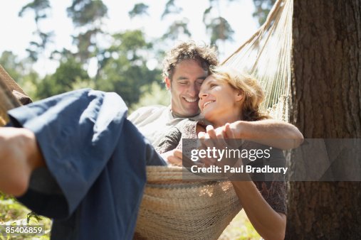 Couple sitting in hammock Couple sitting in hammock