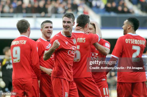 Dons' Darren Potter celebrates scoring the fourth goal during the FA Cup Fourth Round match at Loftus Road, London.