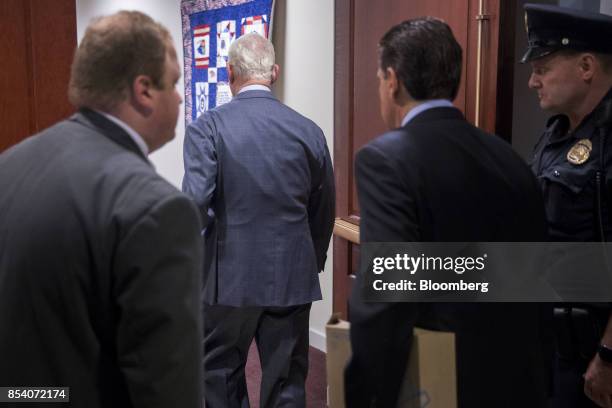 Roger Stone, former adviser to Donald Trump's presidential campaign, second left, arrives to a closed-door House Intelligence Committee hearing on...