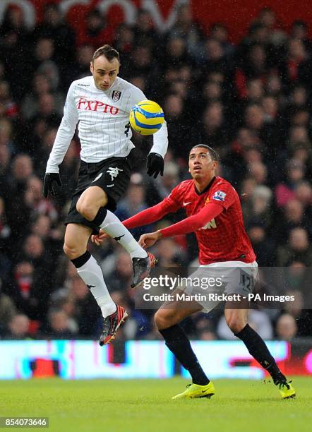 Fulham's Dimitar Berbatov and Manchester United's Chris Smalling battle for the ball