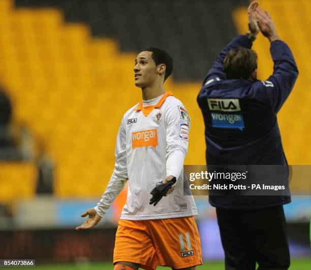 Blackpool's Thomas Ince looks up to his parents Paul Ince and Claire Ince after scoring during the npower Football League Championship match at...