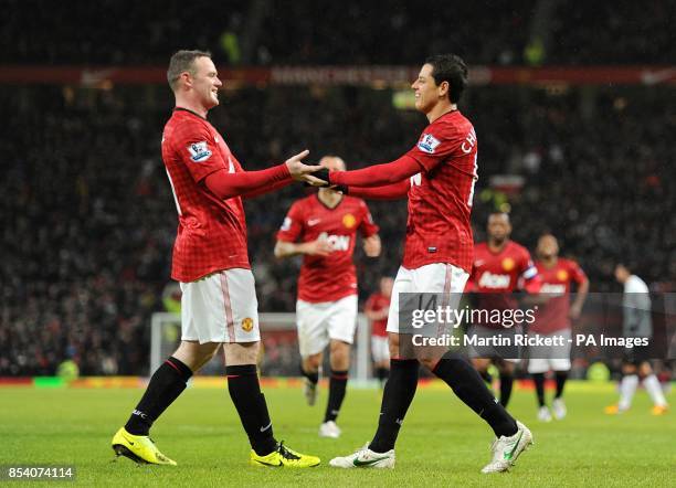 Manchester United's Javier Hernandez celebrates scoring their fourth goal of the game with team-mate Wayne Rooney