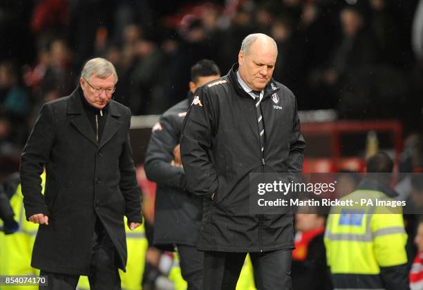 Fulham manager Martin Jol and Manchester United manager Sir Alex Ferguson leave the touchline after the final whistle