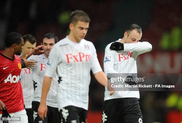 Fulham's Dimitar Berbatov appears dejected as he leaves the field of play after the final whistle