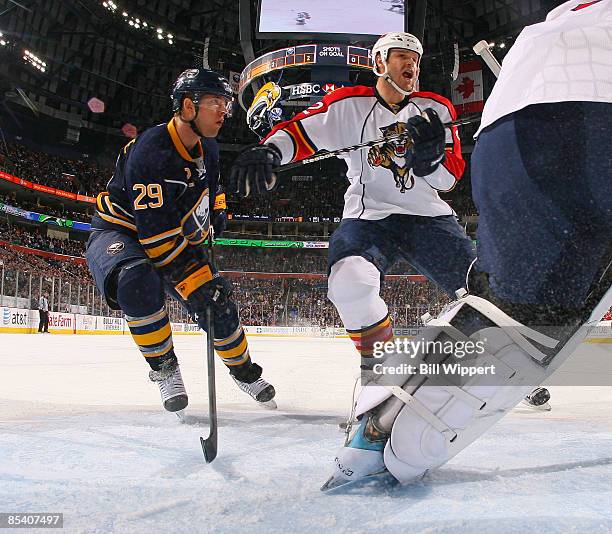 Jason Pominville of the Buffalo Sabres is guarded by Jassen Cullimore of the Florida Panthers on March 12, 2009 at HSBC Arena in Buffalo, New York.