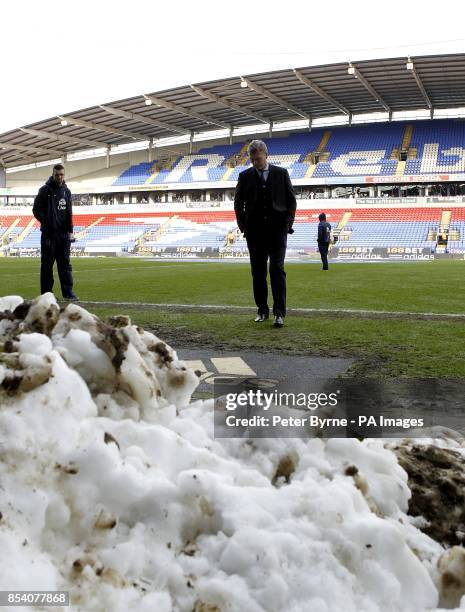 Everton Manager David Moyes assesses the pitch ahead of the FA Cup Fourth Round match at the Reebok Stadium, Bolton.