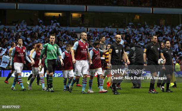 The two teams and match officials walk out before kick-off