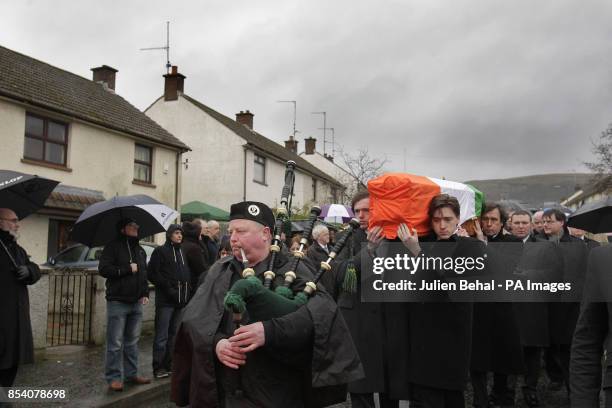 Dolours Price's coffin is carried from her family home Slievegallion Drive in Andersontown West Belfast by her two sons Danny and Oscar at front and...