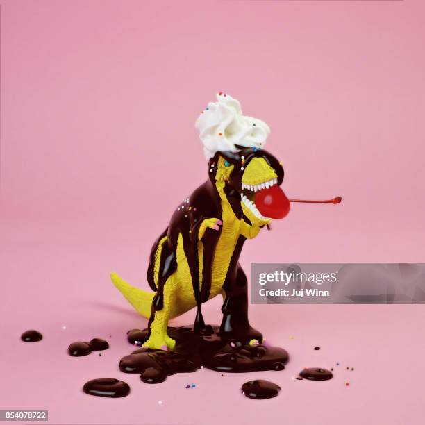 plastic t-rex dinosaur toy as chocolate sundae - ice cream sundae stock pictures, royalty-free photos & images