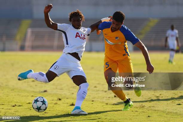Kazaiah Sterling of Tottenham Hotspur holds off Zacharias Adoni of APOEL Nicosia as he shoots during UEFA Youth League Group H match between Apoel...