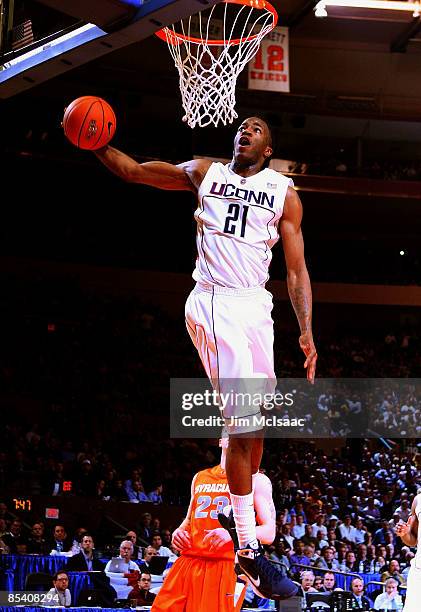 Stanley Robinson of the Connecticut Huskies dunks the ball against the Syracuse Orange during the quarterfinals of the Big East Tournament at Madison...