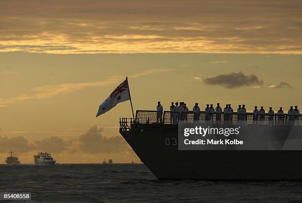 Sailors are seen standing on deck of ship entering through the Sydney heads during a ceremonial exercise involving The Royal Australian Navy's Fleet...