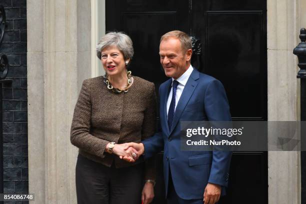 British Prime Minister Theresa May greets President of the European Council, Donald Tusk in Downing Street, London on September 26, 2017. Theresa May...