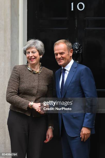 British Prime Minister Theresa May greets President of the European Council, Donald Tusk in Downing Street, London on September 26, 2017. Theresa May...