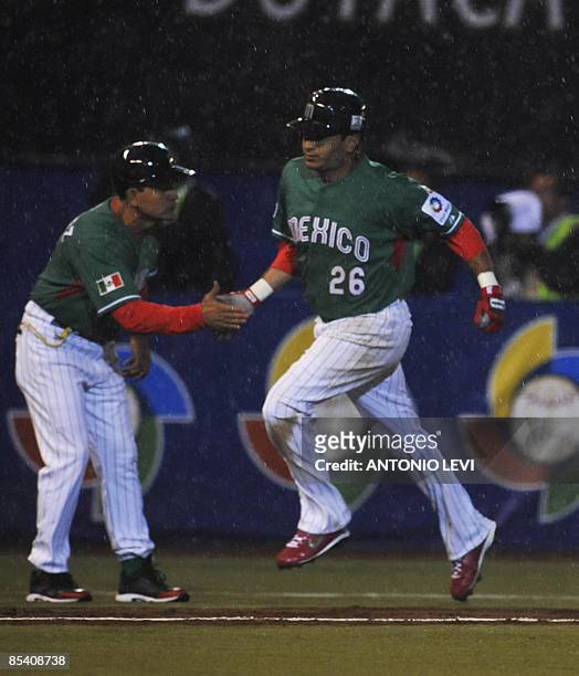 Mexico's Oscar Robles rounds the bases after hitting a homerun against Cuba during their group B World Baseball Classic contest at Foto Sol Stadium...