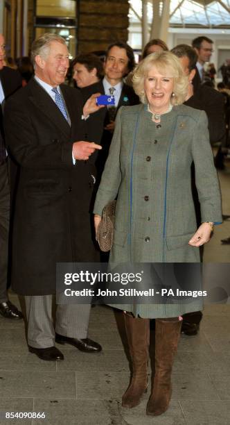 The Prince of Wales and the Duchess of Cornwall at King's Cross train Station, during a visit to the terminal in central London.