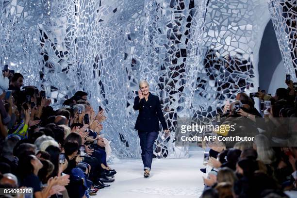 Italian fashion designer Maria Grazia Chiuri for Christian Dior acknowledges the audience at the end of the women's 2018 Spring/Summer ready-to-wear...