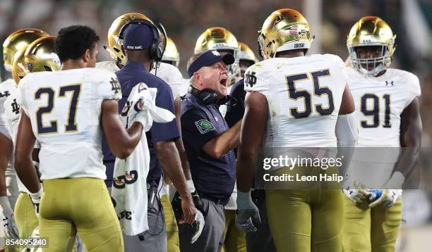 Notre Dame Fighting Irish head coach Brian Kelly reacts during the second quarter of the game against the Michigan State Spartans at Spartan Stadium...