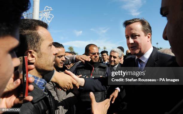 Prime Minister David Cameron takes a walk through Martyrs Square in Tripoli, Libya where he met local market traders and visitors.