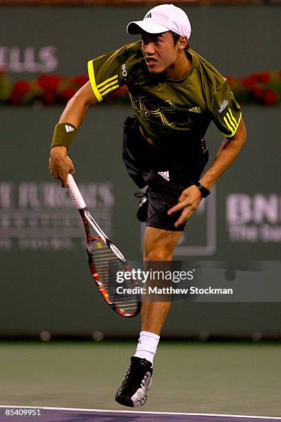 Kei Nishikori of Japan serves to Ivan Ljubicic of Croatia during the BNP Paribas Open at the Indian Wells Tennis Garden March 11, 2009 in Indian...