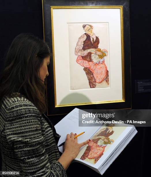 Woman views Egon Schiele's Lovers - Self Portrait with Wally as Sotheby&Otilde;s previews its forthcoming February sales of Impressionist & Modern...