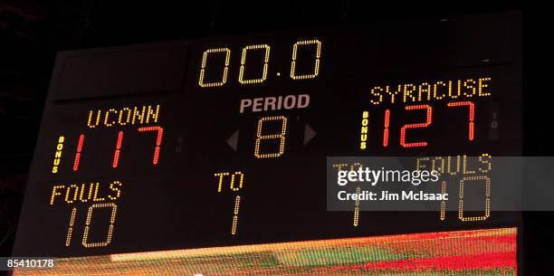 The scoreboard with the final score displayed after six overtimes between the Syracuse Orange and the Connecticut Huskies during the quarterfinals of...