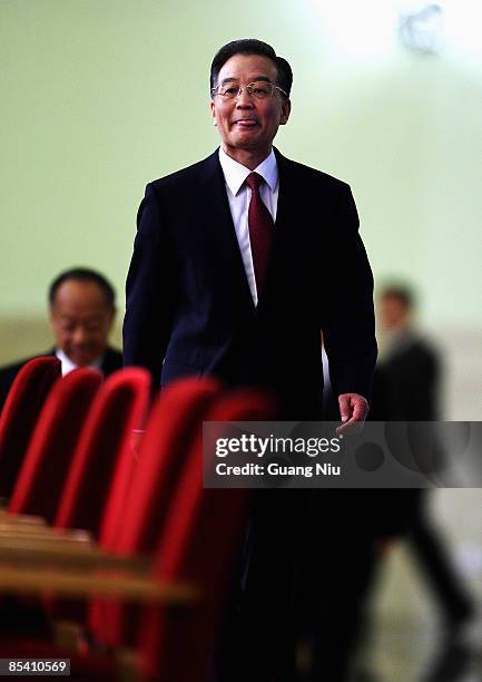 China's Premier Wen Jiabao arrives at a news conference at the Great Hall of the People after the closing session of the National People's Congress...