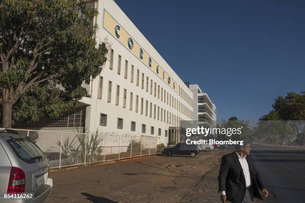 Pedestrian passes in front of a post office in Brasilia, Brazil, on Tuesday, Sept. 12, 2017. President Michel Temer is unwinding it all as he moves...