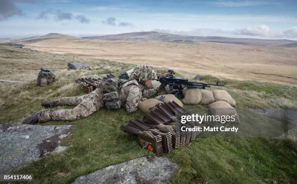 Soldier from 6 RIFLES prepares to fire live ammunition from a General Purpose Machine Gun on the range at Okehampton Camp, Dartmoor, during the 6th...