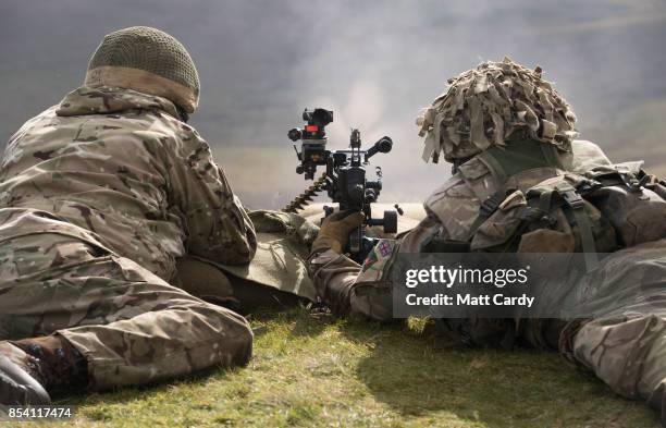 Soldiers from 6 RIFLES fire live ammunition from a General Purpose Machine Gun on the range at Okehampton Camp, Dartmoor, during the 6th Battalion,...