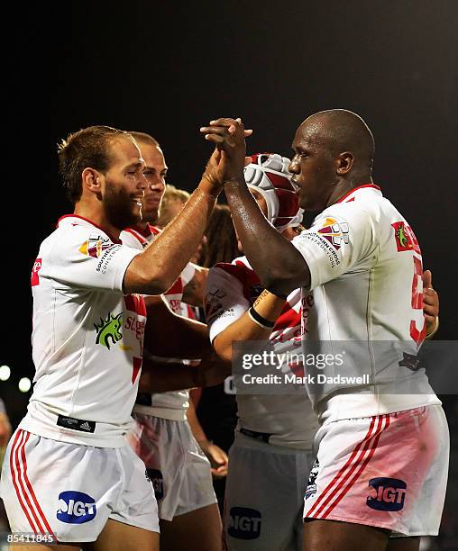 Dragon players celebrate a try during the round one NRL match between the Melbourne Storm and the St George Illawarra Dragons at Olympic Park on...