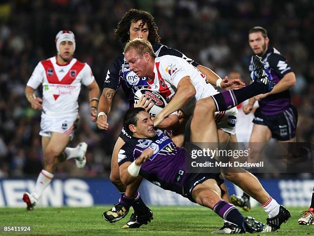 Matt Prior of the Dragons steamrolls Billy Slater of the Storm during the round one NRL match between the Melbourne Storm and the St George Illawarra...