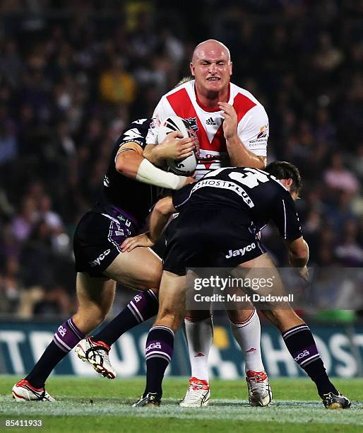 Michael Weyman of the Dragons is tackled during the round one NRL match between the Melbourne Storm and the St George Illawarra Dragons at Olympic...