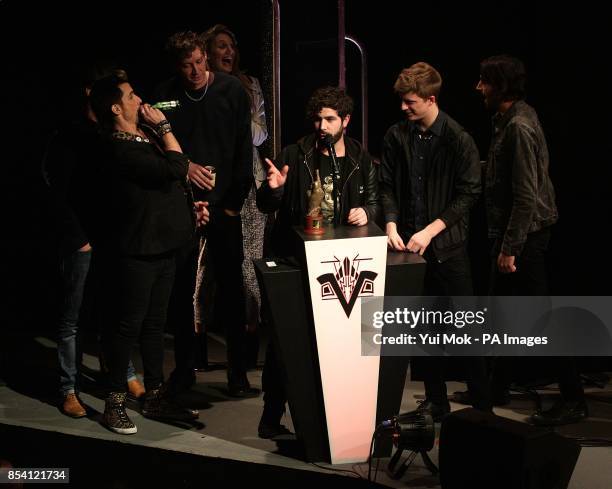 Foals collect the award for Best Track for 'Inhaler', on stage during the 2013 NME Awards, at the Troxy, London.