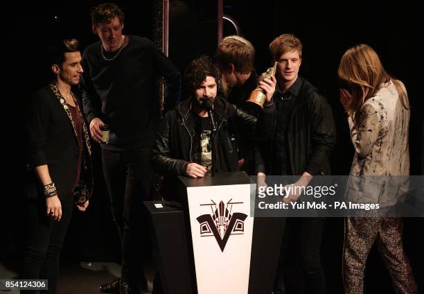 Foals collect the award for Best Track for 'Inhaler', on stage during the 2013 NME Awards, at the Troxy, London.