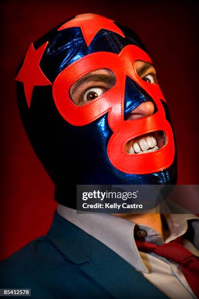 man in suit and mexican wrestling mask - wrestling mask stock pictures, royalty-free photos & images