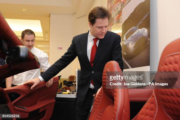 Deputy prime minister Nick Clegg inspects the interior of an Aston Martin Vanquish during the BIS Manufacturing Summit at The Heritage Motor Centre...