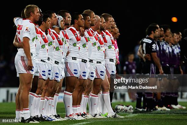 The Dragons and the Storm line up for the National Anthem during the round one NRL match between the Melbourne Storm and the St George Illawarra...