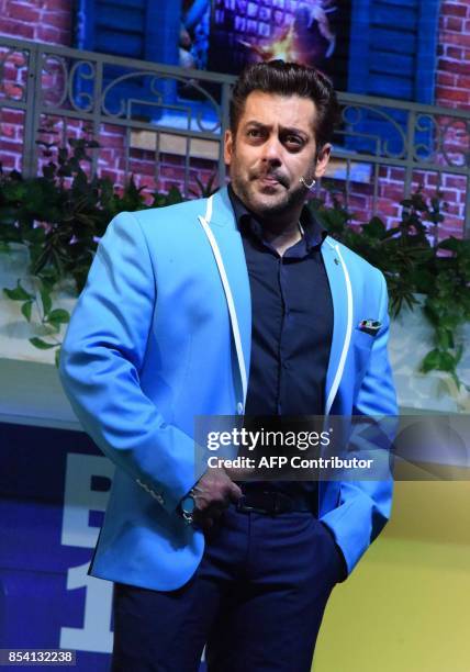 Indian Bollywood actor Salman Khan stands on stage during a launch event for the upcoming 11th edition of the televison reality show 'Big Boss'...