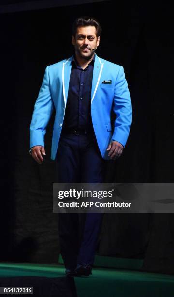 Indian Bollywood actor Salman Khan stands on stage during a launch event for the upcoming 11th edition of the televison reality show 'Big Boss'...