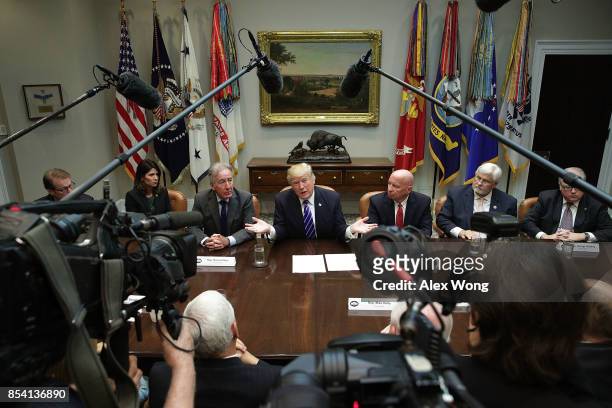 President Donald Trump speaks during a meeting with members of the House Ways and Means Committee as committee chairman Rep. Kevin Brady and ranking...