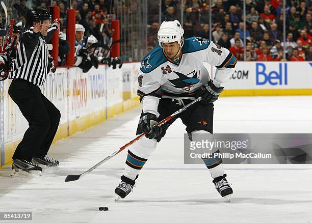 Jonathan Cheechoo of the San Jose Sharks skates with the puck against the Ottawa Senators during the game on February 26, 2009 at the Scotiabank...
